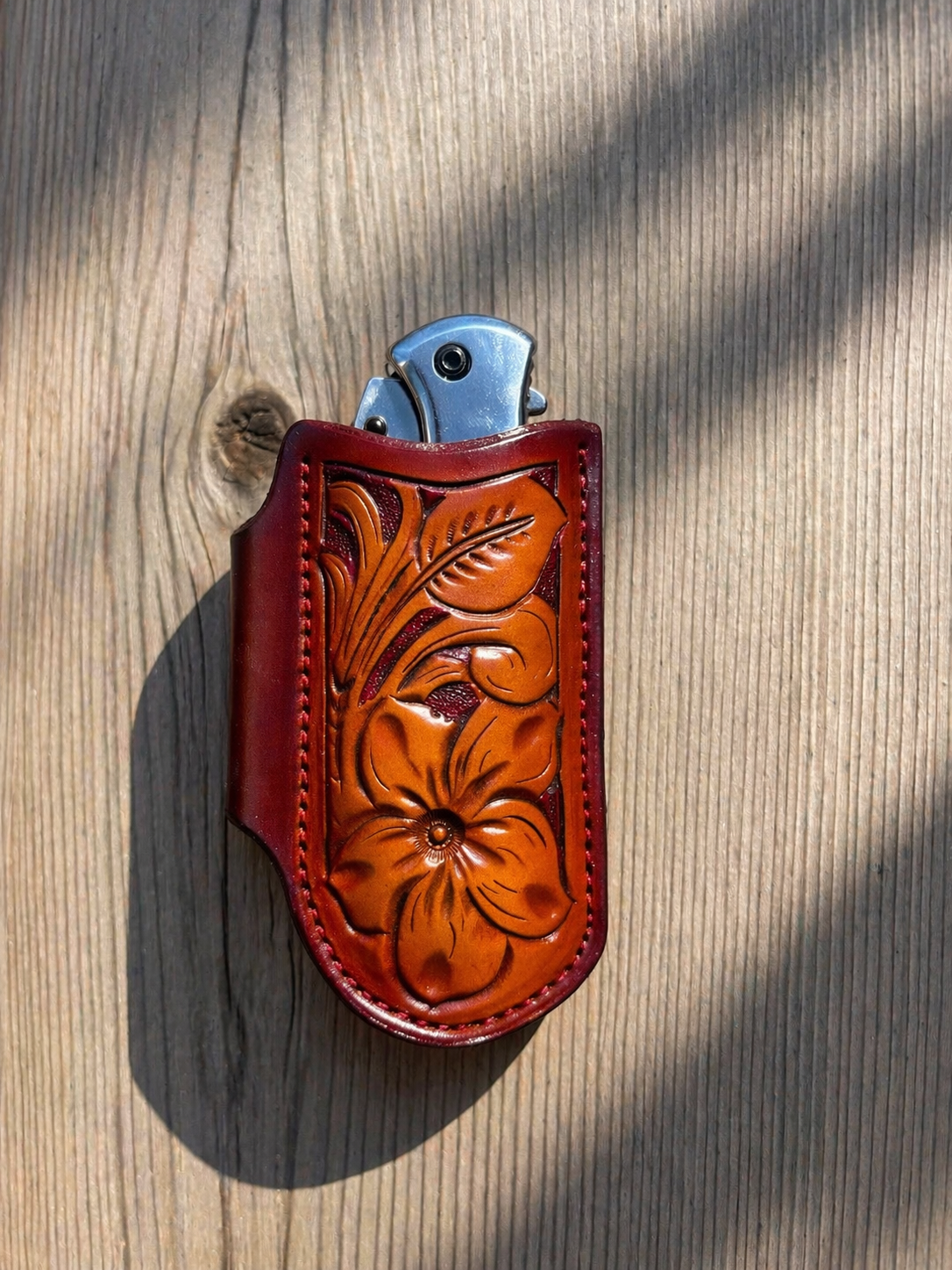 Horizontal hand tooled leather pocket knife sheath